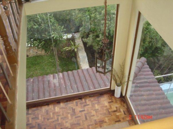 view of living room glass window corner from the attic/loft